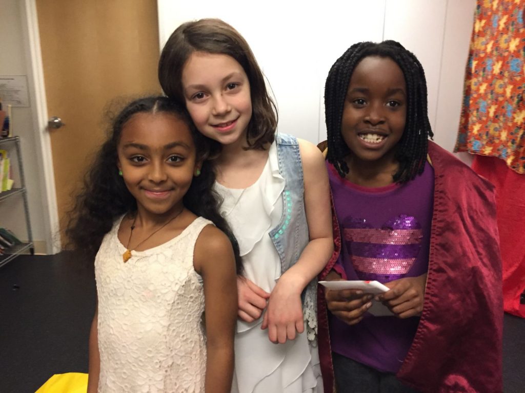 Three children posing for a photo